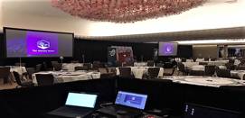 A conference room with a production booth