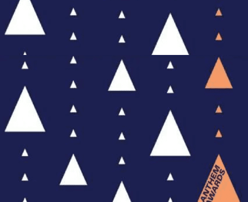 A lot of white and orange triangles on a blue background